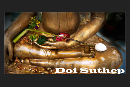 A closeup of the open palm of a buddha statue, caption reads "Doi Suthep"